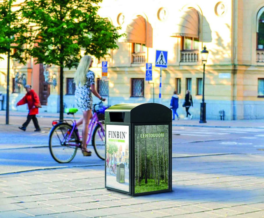Beautiful blonde girl riding a bicycle in Stockholm