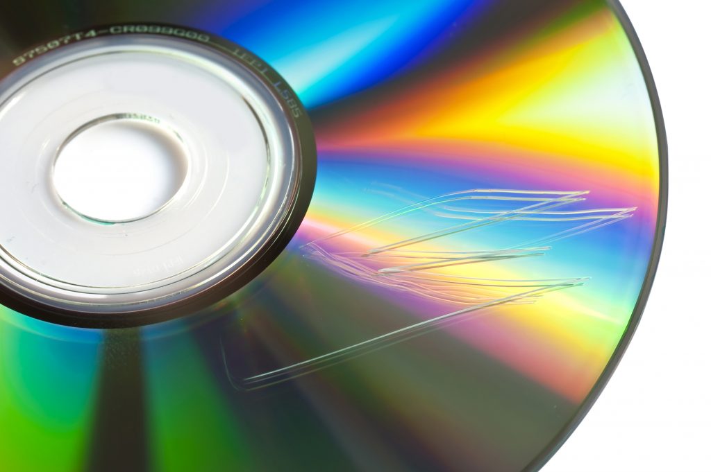 Scratched cd or dvd close up, data loss concept